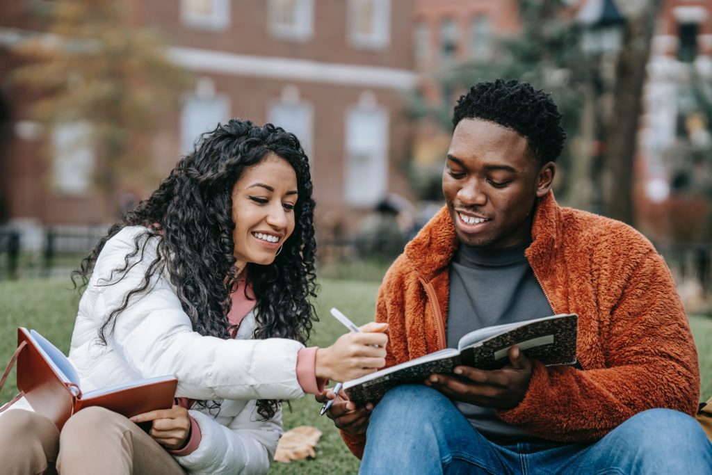 Student ambassador talking to another student outside on campus