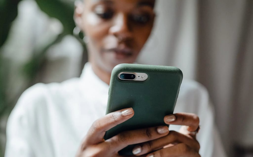 Woman making a referral with her phone